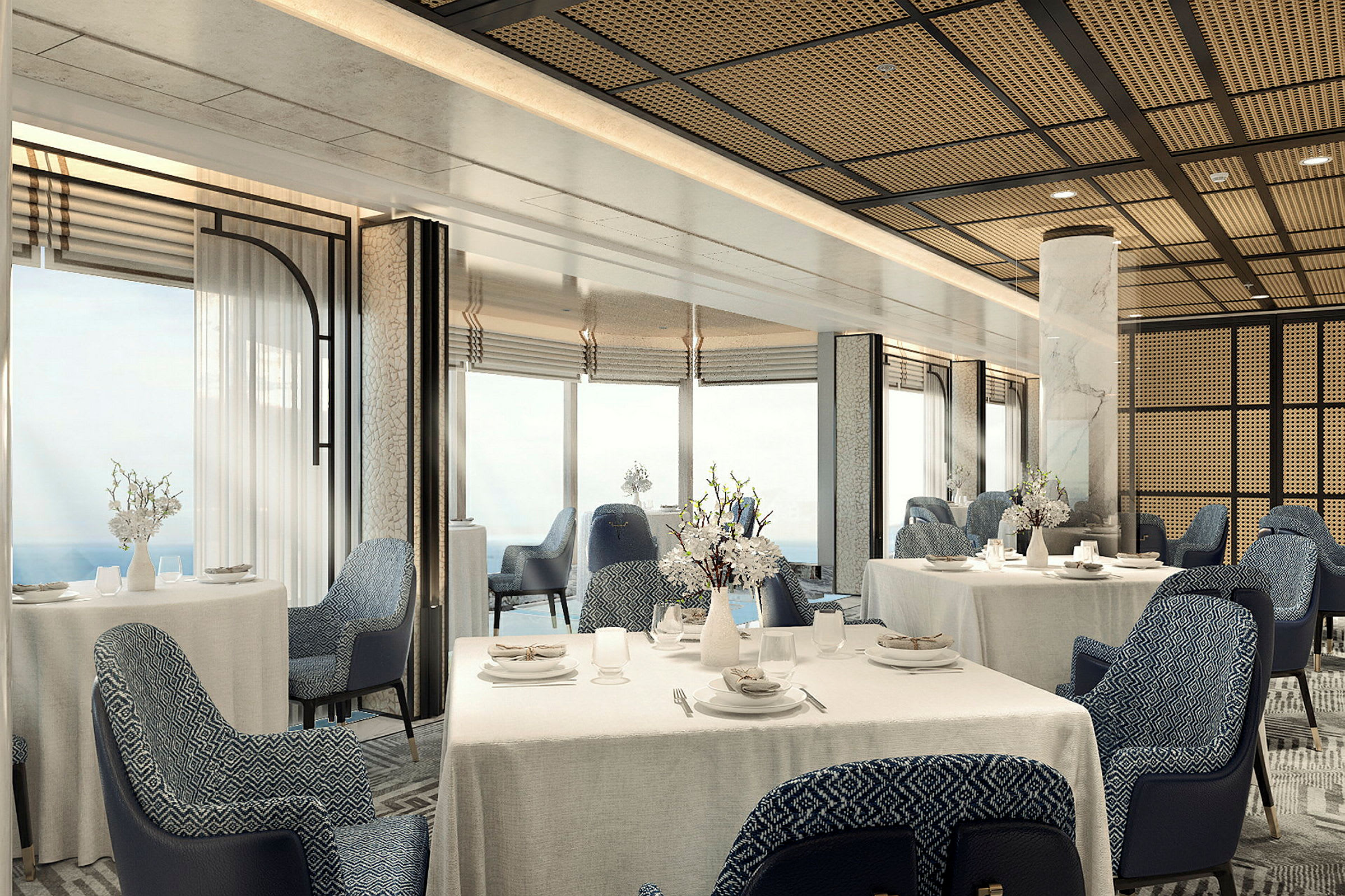 Ett elegant dukat matbord med blå stolar i en rymlig restaurang med panoramautsikt. (AI-genererad text)