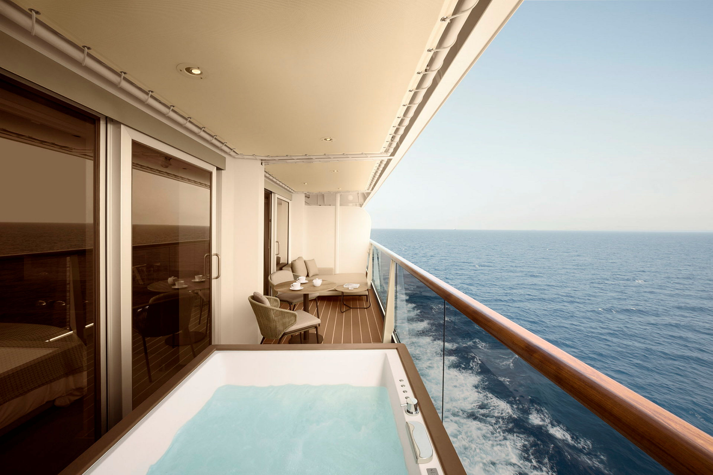 En balkong på ett fartyg med en jacuzzi och sittmöbler, samt utsikt över havet. (AI-genererad text)